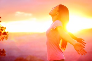 Free happy woman enjoying nature sunset. Freedom, happiness and